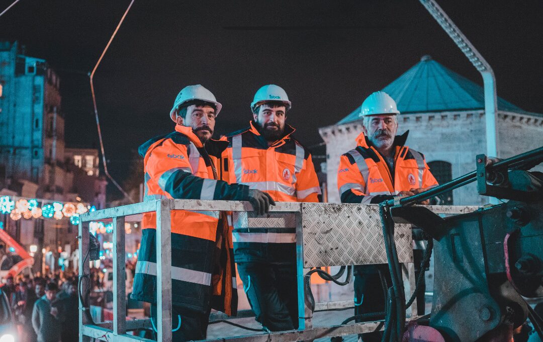 Construction workers at night in the winter